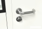 Hall office prefab in detail view of the door handle and locking mechanism from the inside